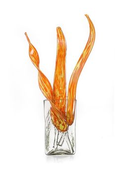 a glass vase with an orange flower in it