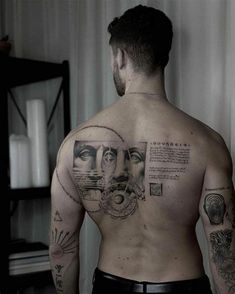 a man with many tattoos on his back