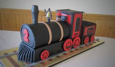 a birthday cake made to look like a train engine