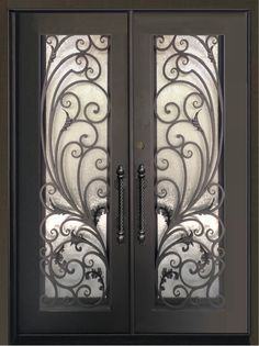 an ornate iron door with glass panels