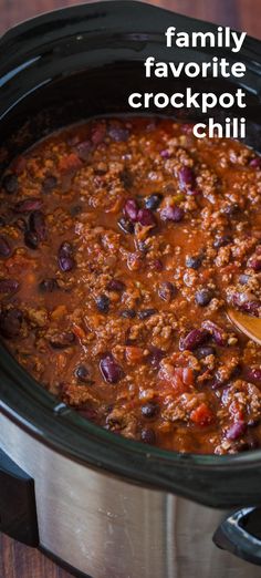 a slow cooker filled with chili and beans