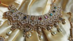 This elegant and gorgeous choker with matching earrings and tikka and is sure to be a hit for any event! The gorgeous multi and gold colors can match any outfit and the colors are gorgeous shades with a beautiful finish. Elegant Multicolor Kundan Lehenga, Multicolor Meenakari Bridal Necklace For Party, Bollywood Style Multicolor Bridal Necklace With Zari Work, Multicolor Chandbali Bridal Necklace For Party, Elegant Multicolor Meenakari Lehenga, Elegant Multicolor Festive Choker, Festive Multicolor Lehenga With Stone Work, Multicolor Kundan Choker Necklace For Wedding, Heavy Multicolor Kundan Necklace For Party