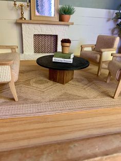 a miniature living room with chairs and a coffee table