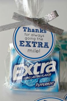 an extra chewing bar wrapped in plastic and tied with a silver ribbon on top of it