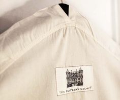 a white shirt with a black and white label on it