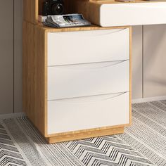 a white and wood desk with a camera on it's top shelf next to a wall