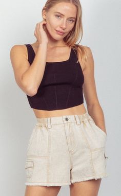 The Cloud Cargo Short in beige are chic and casual high-waisted shorts. The neutral color palette is a versatile choice, offering a refreshing take on a summer staple. They're designed with a raw hemline to add a bit of edge to your ensemble, and the... 90s Fashion Models, Denim Cargo Shorts, Simple Tank Tops, Neutral Color Palette, Denim Cargo, Cargo Short, Swim Fashion, Summer Staples, Washed Denim