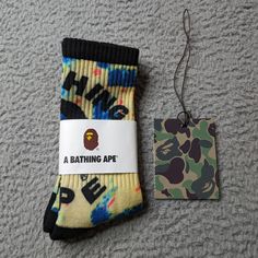 A Bathing Ape Crew Socks Logo Mens Womens Unisex Size: One Size Fits All Color: Multicolor (Black Heel & Toe) Brand New In Packaging. Fast Shipping! 1 Day Shipping And Handling. Sporty Multicolor Cotton Socks, Sporty Multicolor Socks For Winter, Sporty Multicolor Winter Socks, Casual Multicolor Socks For Streetwear, Sporty Yellow Cotton Socks, Casual Blue Socks With Letter Print, Tie Dye Socks, Head Ties, Tie Dye Colors