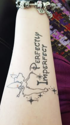 a person with a tattoo on their arm that says, perfect day and an arrow