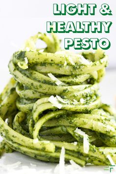 green pasta with pesto on top and the words light & healthy pesto above it