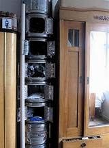 an open cabinet next to a mirror in a room