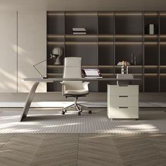 an office with a desk, chair and bookcase on the wall next to it