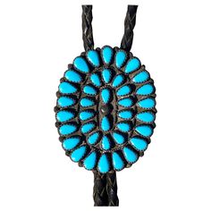 1950s Navajo artist made from New Mexico. Handcrafted from pawn silver and set with turquoise, the rope is hand-woven leather, and the tips are silver. Vintage Navajo Jewelry Garland's, Navajo Pearls And Turquoise Necklace, Pueblo Native Americans, Turquoise Bolo Tie, Navajo Squash Blossom Necklace, Navajo Traditional Necklace Turquoise, Turquoise Squash Blossom, French Victorian, American Craftsman