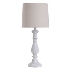 a white table lamp with a linen shade on it's base and an off - white lampshade