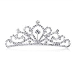 PRICES MAY VARY. As a princess tiara comb, it's brilliant with silver plated metal bend Measured 4.3*4*1.6 inches, great for girls and kids The tiara for women is Light, do not bring a headache. And it also has a comb to hold in place Amazing quality of workmanship of the tiara, is very sturdy and well made It's dainty, fancy gift for birthday, wedding, prom, party This product is a charming and shiny tiara, the adoption of silver plating technology and rhinestone material gives it diamond look Princess Party Costume, Rhinestone Material, Rhinestone Tiara, Princess Tiara, Birthday Princess, Tiara Crown, Fancy Gifts, Crown Headband, Rhinestone Wedding