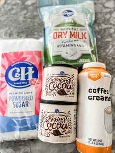 coffee, ice cream and sugar are sitting on the counter next to bags of food