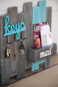 a couple of wooden racks holding keys and magazines