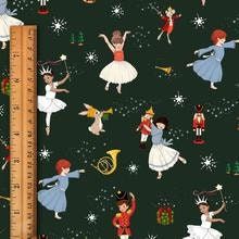 a ruler is shown next to a black background with dancers and snowflakes on it