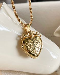 The Mon Amour Locket, my love locket is a beautiful locket you can keep your treasures close to the heart. Gold plated silver functioning heart locket measuring 25mm x20mm x6.7mm. You can adhere photos or leave a secret message . Gold plated brass rope chain 2.5mm thick and 16-18 inches in length . Heart Shape Locket Gold, Wedding Heart Pendant Locket Necklace With Charms, Double Heart Locket Necklace Keepsake, Double Heart Locket Necklace For Keepsake, Open Heart Locket Jewelry For Keepsake, Open Heart Keepsake Locket, Keepsake Double Heart Locket Jewelry, Vintage Charm Heart Pendant Locket Necklace, Open Heart Locket Necklace Keepsake