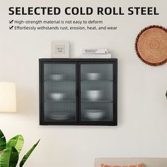 a black cabinet sitting next to a white wall with an advertisement above it that reads, selected cold roll steel