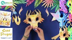 someone is making a dragon mask out of paper