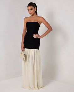 Introducing the Black Strapless Cream Chiffon Maxi Dress, a graceful blend of modern simplicity and timeless elegance. This stunning dress features a sleek, strapless black bodice that accentuates the shoulders and waist, providing a smooth and flattering silhouette. The bodice seamlessly transitions into a flowing cream chiffon maxi skirt that cascades to the floor, creating a soft, ethereal movement with every step. The contrast between the bold black top and the delicate cream skirt adds a sophisticated touch, making this dress perfect to dress down for the day or to dress up for formal events, galas, or evening soirées. Embrace effortless style with this versatile and elegant piece. Corset Pants, Summer Loungewear, Chiffon Maxi Skirt, Cream Skirt, 2 Piece Skirt Set, Wide Trousers, Long Midi Dress, Dresses Xxl, Chiffon Maxi