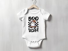 This adorable Ghost Halloween Baby Bodysuit features a cute skater ghost wearing a hat with the text "Boo Yeah", making it perfect for your little one's spooky celebrations. This baby outfit is ideal for Halloween parties, newborn photo shoots, and baby showers. Make this baby gift even more special by adding the name of your little one! 👕 I T E M   I N F O: RABBIT SKINS 4400 ◦ Colors: Solid colors are 100% super soft, combed, ringspun cotton. Heather colors are 90% cotton and 10% polyester. ◦ White Halloween Onesie In Casual Style, Casual White Onesie For Halloween, White Casual Onesie For Halloween, White Casual Halloween Onesie, Cute White Halloween Onesie, Halloween Romper, Baby Halloween Outfits, Skateboard Clothes, Fall Baby Clothes