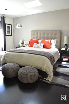 a large bed sitting on top of a black and white checkered floor