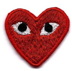 a red heart with two eyes on it