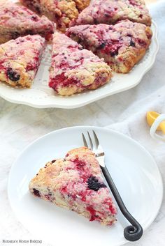 a piece of blueberry scones on a plate with a fork next to it