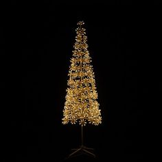 a lighted christmas tree in the dark with gold lights on it's top and bottom