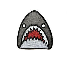 a patch with a shark's teeth on it