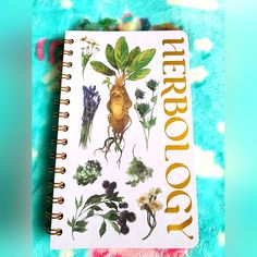 an open notebook with flowers and plants on it