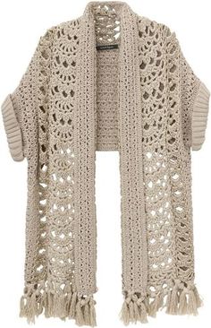 a crocheted shawl with tassels on the ends and an open front