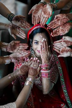 the bride is surrounded by her hands and henches