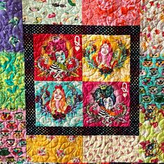 a colorful quilt with many different pictures on it