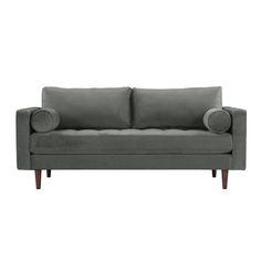 a gray couch sitting on top of a white floor