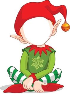 an elf sitting on the floor with a christmas ornament hanging from his ear