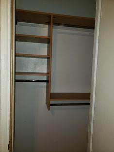 an empty closet is shown with shelves and shelving