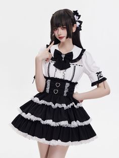 Embrace your inner edgy princess with our stunning gothic Lolita skirt. Adorned with heart-shaped buckles and delicate white lace, the high-waisted design features shirring at the back for a comfortable and flattering fit. The three layers of black fabric are accented with striking white ruffled lace trims, creating a dramatic and elegant look that's perfect for any alternative fashion enthusiast.   	 		 			Size 			S 			M 			L 		 		 			Full Length 			45 			46 			47 		 		 			Waist 			66-96 			70- Gothic Lace Trim Skirt For Costume Party, Gothic Skirt With Lace Trim For Costume Party, Gothic Ruffled Mini Skirt For Halloween, Edgy Princess, Gothic Skirt With Lace Trim For Alternative Fashion, Gothic Lace Trim Skirt For Alternative Fashion, Gothic Ruffled Mini Skirt For Alternative Fashion, Gothic Ruffled Mini Skirt For Cosplay, Harajuku Style Fitted Ruffled Mini Skirt