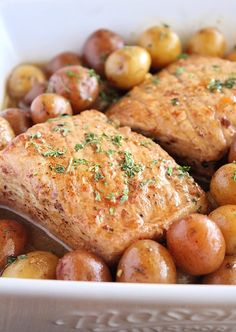 some meat and potatoes in a white bowl