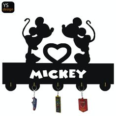 mickey and minnie mouse hanging from the side of a sign that says mickey with two hearts