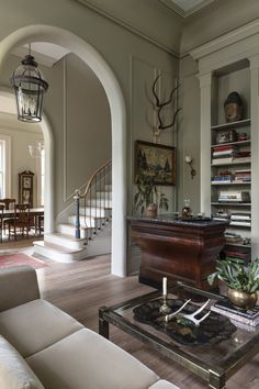 a living room filled with furniture and a fire place