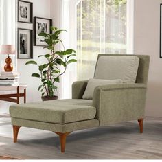 a living room scene with focus on the chair and footstool