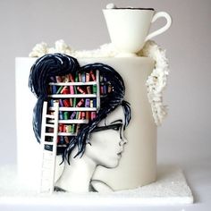 a coffee cup with a book shelf on it and a woman's face painted on the side