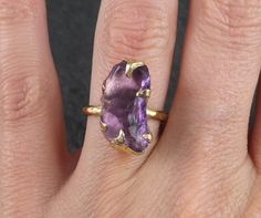 Amethyst Gold Ring Purple Gemstone Recycled 18k Gold Gemstone One of a kind Birthstone Unique Cocktail Statement ring byAngeline I hand carved the ring setting in wax then cast this treasure in recycled solid 18k gold in my home studio. I created a very organic rustic look for the setting. This ring is a size 6 1/2 it can be resized up or down. This amethyst gemstone is about 17mm X 9mm. This ring is rustic and handmade with love. Through out all of time and history in every tribe and culture al Yellow Gold 14k Rings With Natural Stones, Natural Gemstones For Anniversary, Handmade Amethyst Ring In Yellow Gold, Amethyst Gemstones In Yellow Gold With Prong Setting, Amethyst Gemstones In Prong Setting - Yellow Gold, Gold Amethyst Ring With Large Stone As Gift, Yellow Gold Amethyst Jewelry With Prong Setting, Yellow Gold Amethyst Ring Gift, Handmade Yellow Gold Gemstones For Anniversary