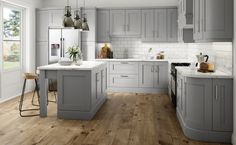 an image of a kitchen setting with wood flooring