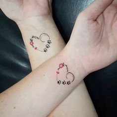 two wrist tattoos with hearts and flowers on them