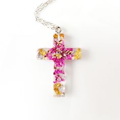 Сross necklace with pressed flowers in resin jewelry .  Simply lovely flower cross necklace with real pressed rink flower  and gold . This pendant made with real flowers and clear jewelry high-quality resin. Total length of approx: 1 inches Christian cross necklace: https://www.etsy.com/listing/552756206/cross-necklace-real-flowers-jewelry?ref=shop_home_active_61&pro=1&frs=1 https://www.etsy.com/listing/640326800/sross-from-real-flowers-in-resin-baptism?ref=shop_home_active_62&pro=1&frs=1 https: Pink Cross Necklace For Gifts, Pink Cross Pendant Jewelry As Gift, Pink Cross Necklace For Gift, Pink Cross Pendant Necklace For Gift, Pink Cross-shaped Jewelry Gift, Pink Cross-shaped Jewelry For Gift, Handmade Cross Jewelry For Memorial, Spiritual Necklaces With Pressed Flowers As Gift, Spiritual Style Necklace With Pressed Flowers As A Gift