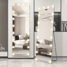 a large mirror with lights on it in a room